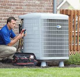 Man fixing air conditioning unit